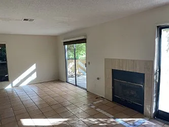 Large living room with beautiful tile floors and large private patio. First floor no steps.