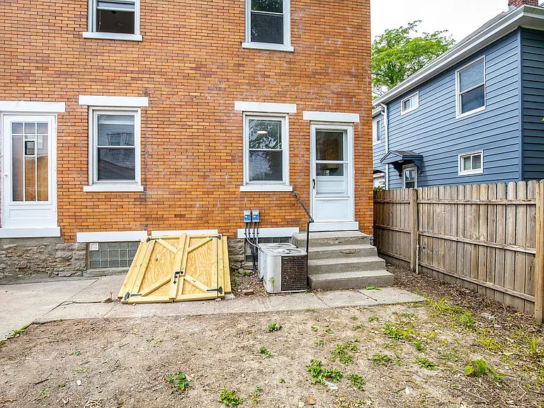 The door from kitchen has direct access to the backyard.