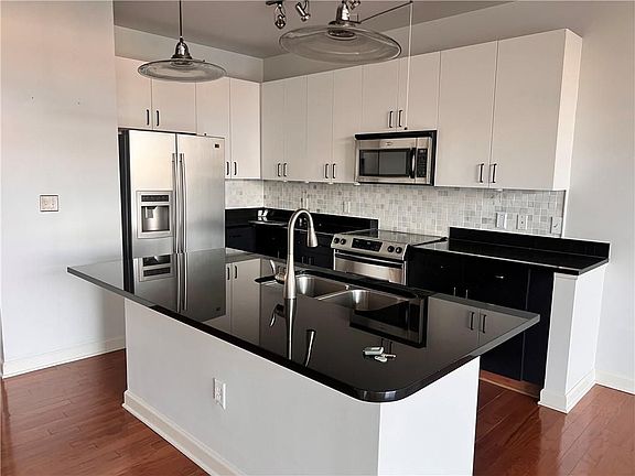 2nd image of 711 Cosmopolitan Dr NE Unit 303