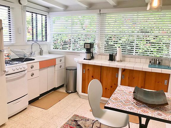 Eclectic and colorful kitchen with stove and oven. Complete