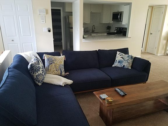 Open to kitchen, guest full bathroom and guestroom.