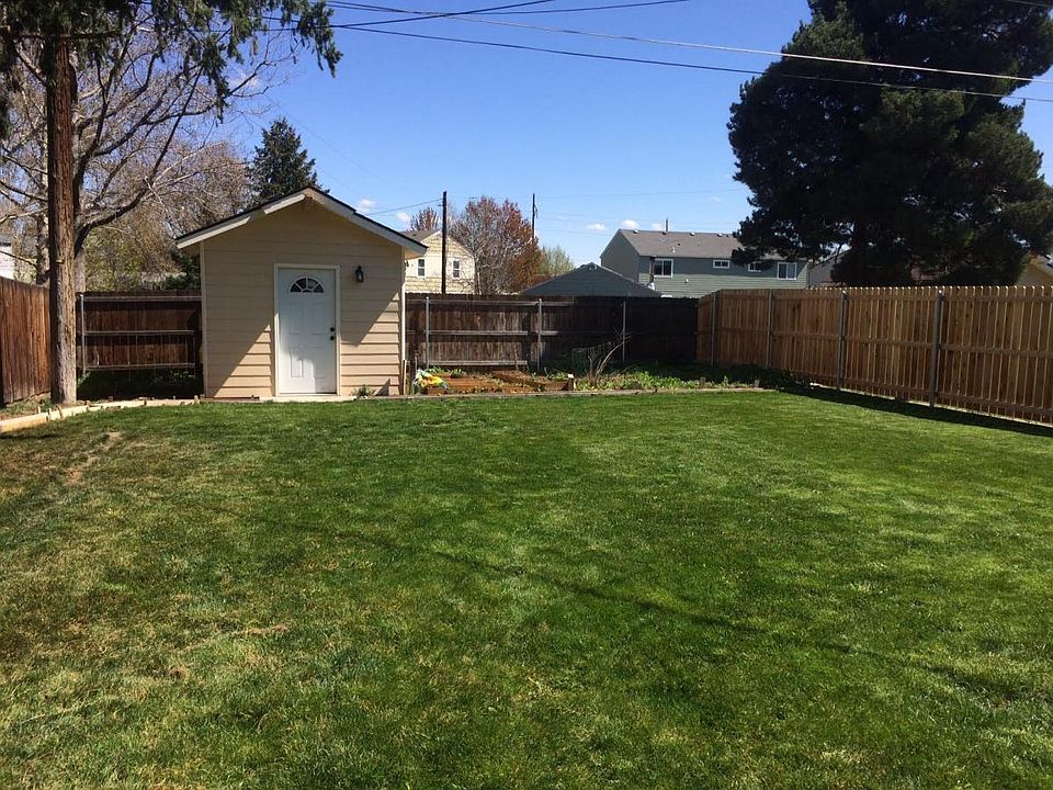 120 square foot lighted storage building with garden area