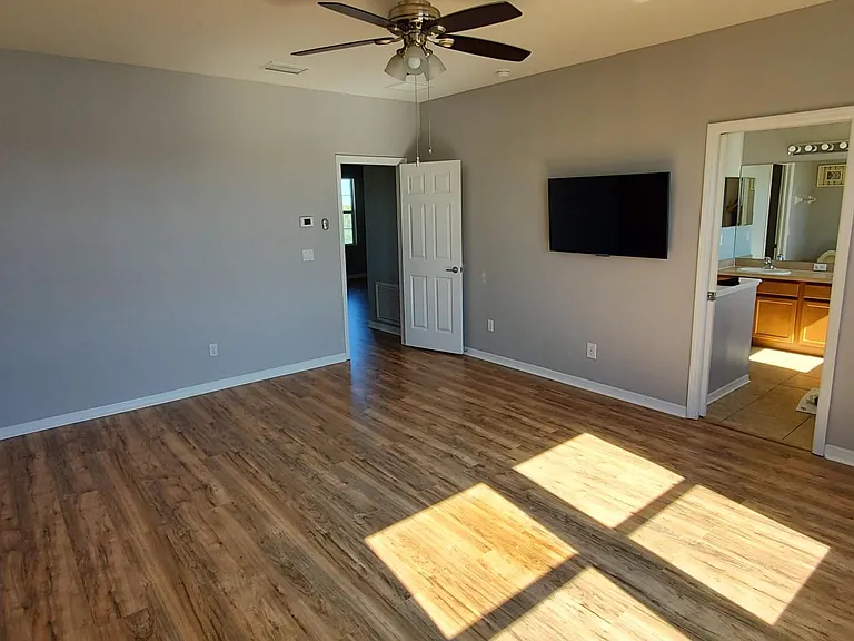 Primary Bedroom facing bathroom