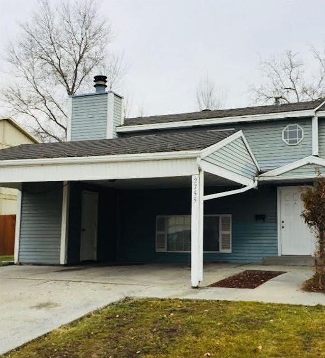 Front of duplex with carport