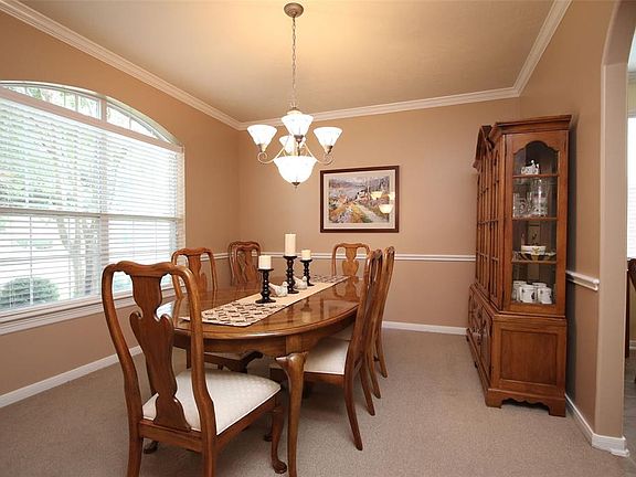 This elegant formal dining room with direct access to the kitchen is the perfect place for those family gatherings.