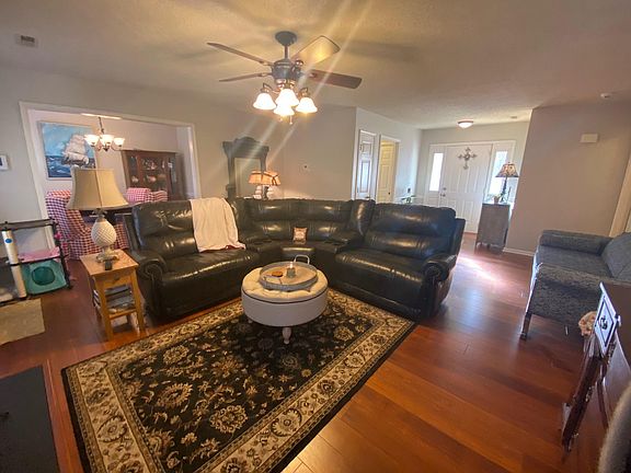 Living room looking into foyer and dining room