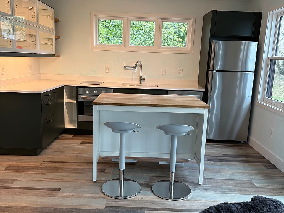 Full kitchen with island/kitchen table with stools. Kitchen will be fully furnished with all kitchenware. An additional table and chairs can be included upon request.