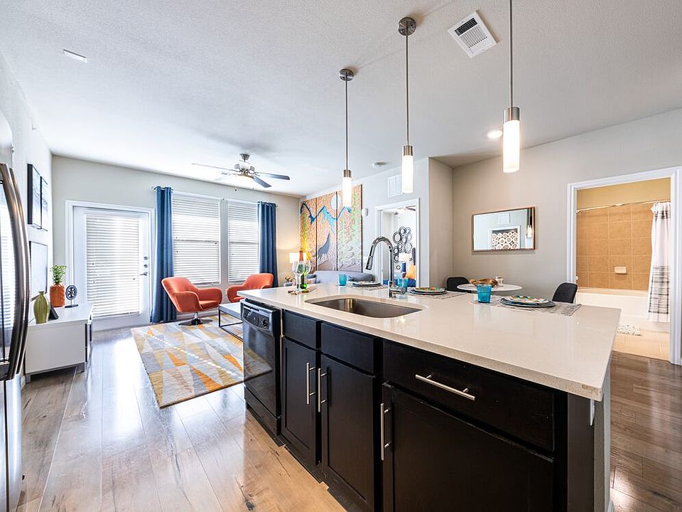 Kitchen, living, and dining area with hard surface flooring