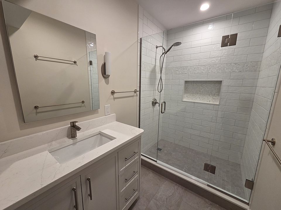 Bathroom with walk-in shower and large vanity