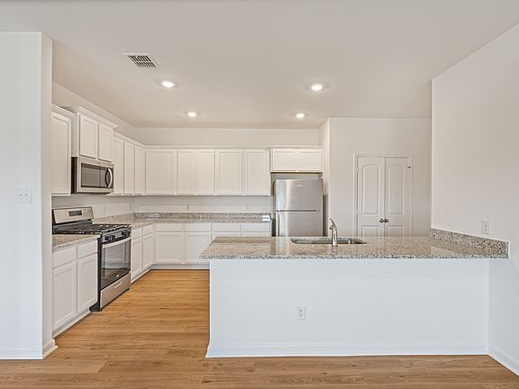 The kitchen is filled with stainless steel appliances!