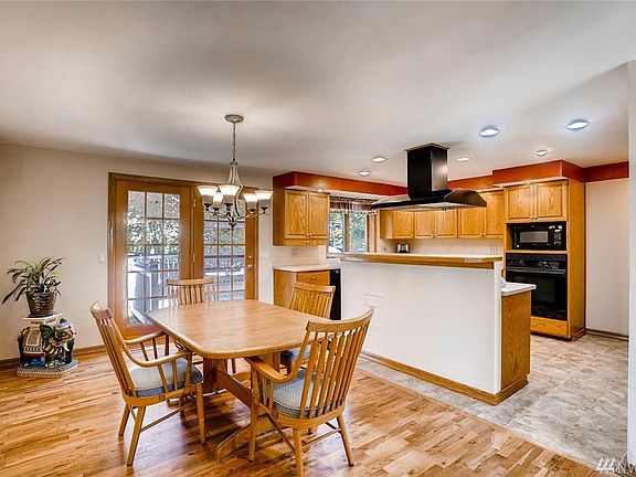 Notice the beautiful hardwood floors and the charming French doors.  (The grids are removable for those who prefer no grids on y