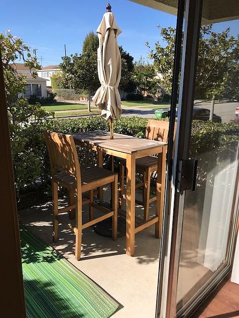 Patio with umbrella table and chairs