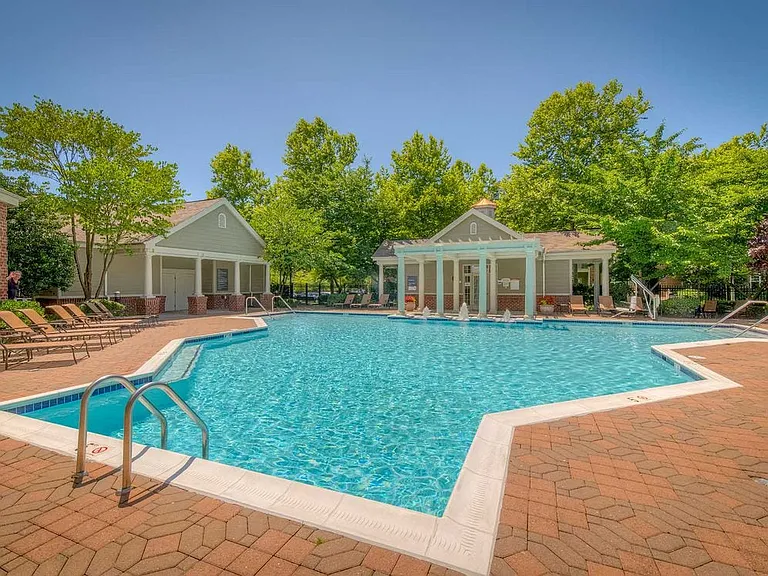 Swimming pool and sundeck with lounge seating