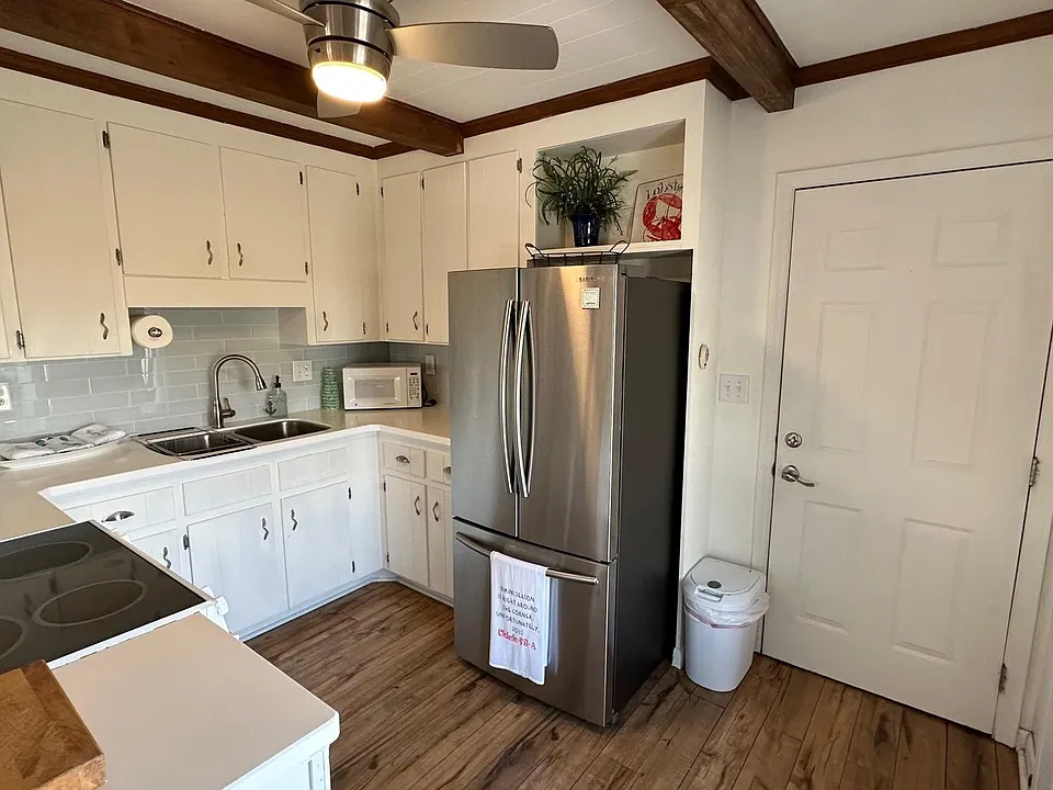 Newly remodeled kitchen with quartz countertops.