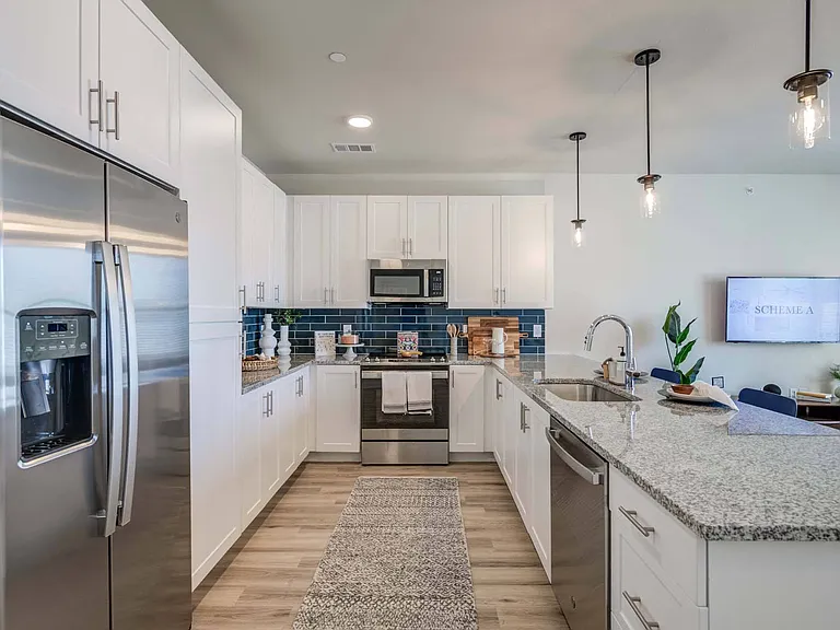 Enjoy cooking and socializing in your well-appointed kitchen, featuring ample counter space and modern appliances.