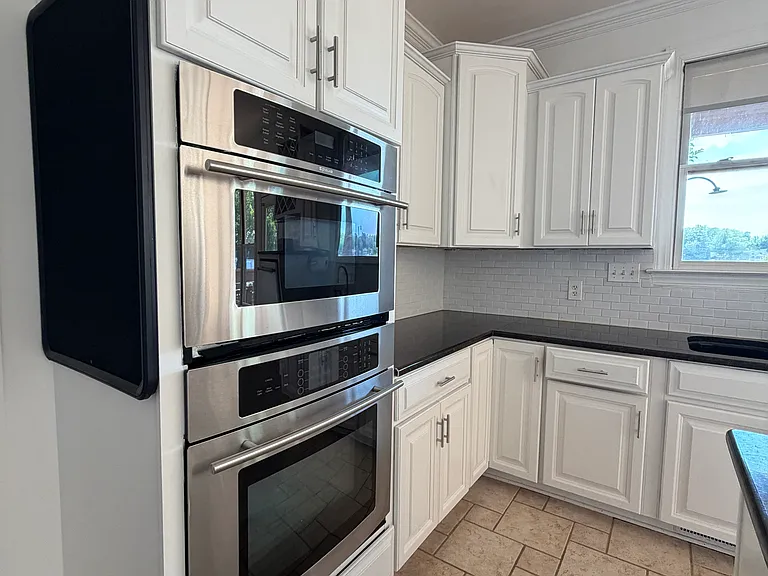 Stainless steel oven and ample cabinet storage for all your kitchen needs.