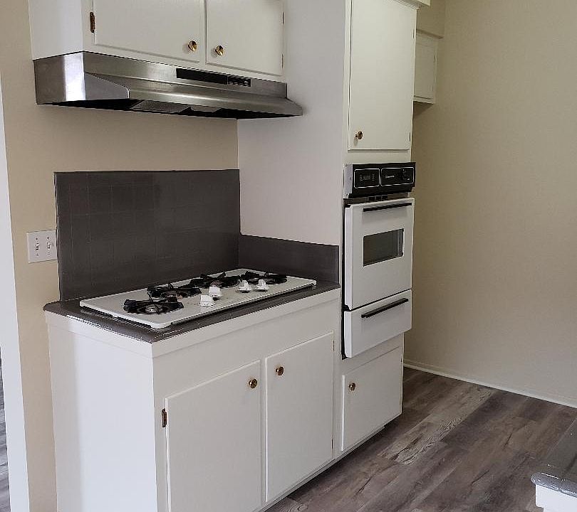 kitchen with gas stove, gas oven, and refrigerator (not shown here)