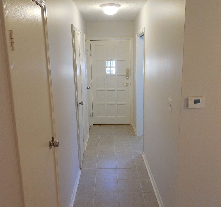 Front hall. Includes pantry, half-bath, and coat closet.
