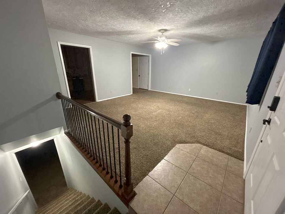Living room 2nd view with stairs to basement