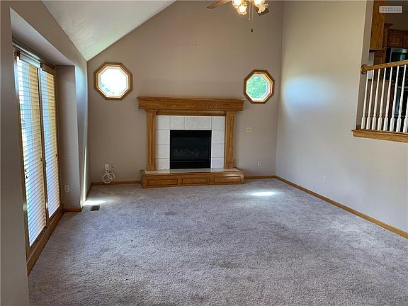 Great room with vaulted ceiling and fireplace