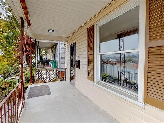 Covered Front porch with privacy screens.