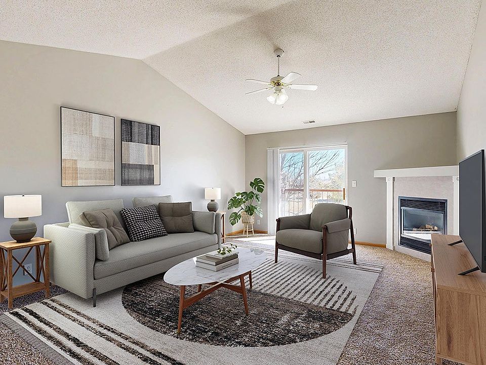 With vaulted ceilings, a cozy fireplace, and plenty of natural light, this Glacier living room is the perfect spot to unwind, gather, or simply enjoy the view.