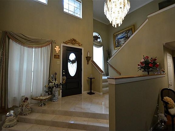 STEP DOWN ENTRYWAY, CHANDELIER, AND HIGH CEILINGS