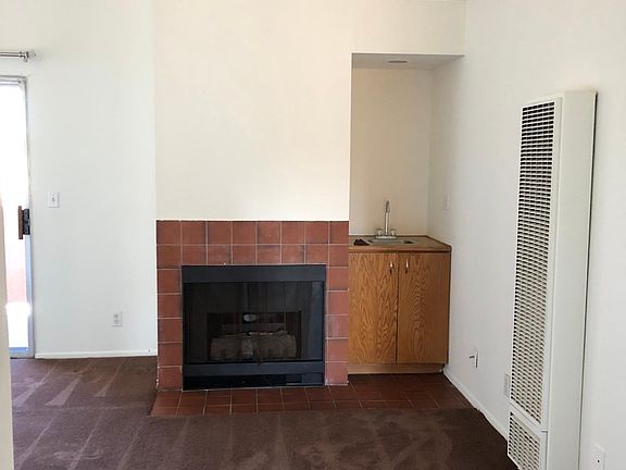 Living room with high ceilings with wet bar