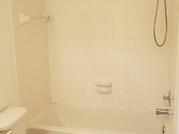 Spacious bathroom with new tile flooring