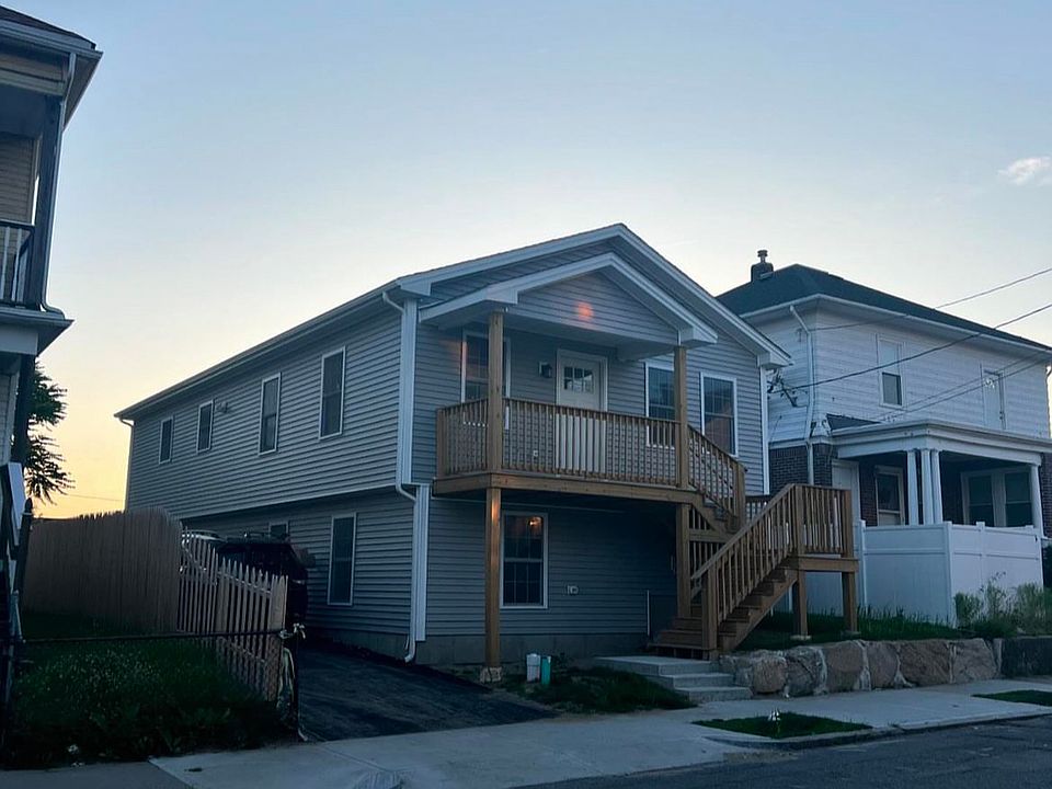 Exterior photo. Off street parking to left of house. Unit is entire upstairs