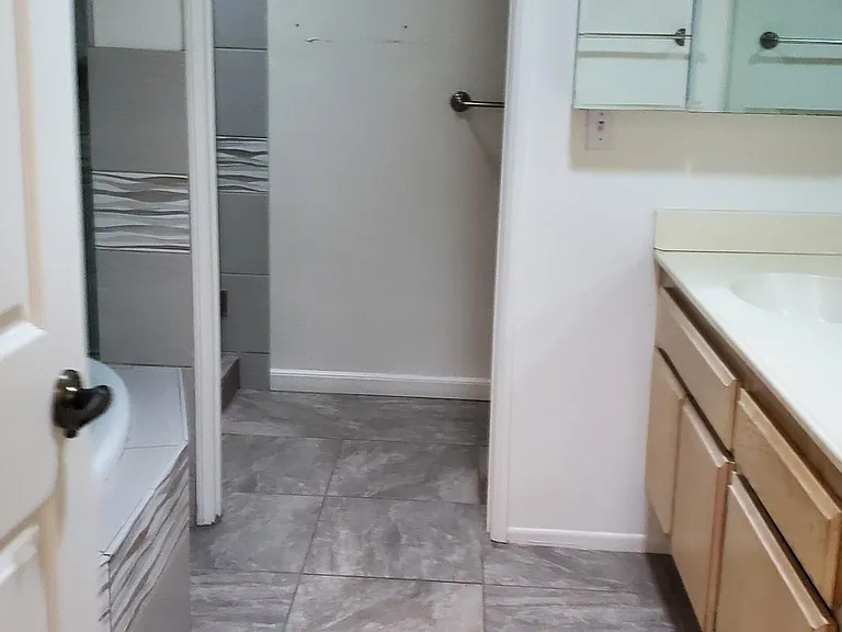Master bathroom has jetted tub, separate shower and two sinks.