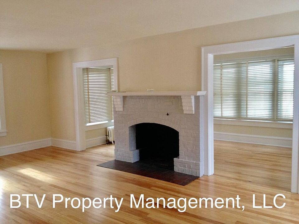 Living room towards sun room (decorative fireplace only)