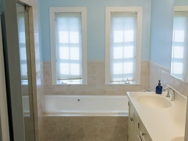 Primary bath with dual vanities.