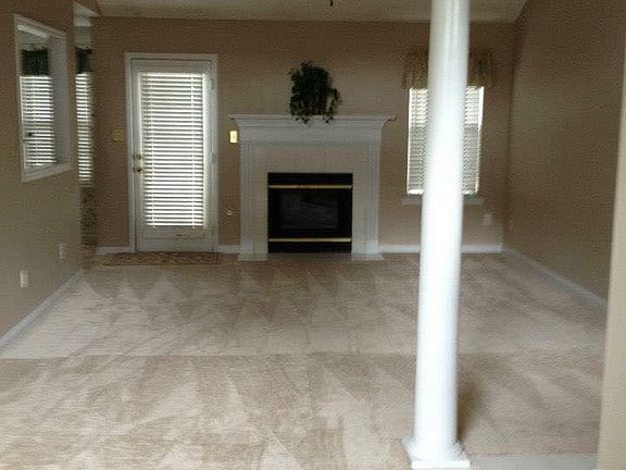 Family Room with Gas Fireplace and Dining Room Area
