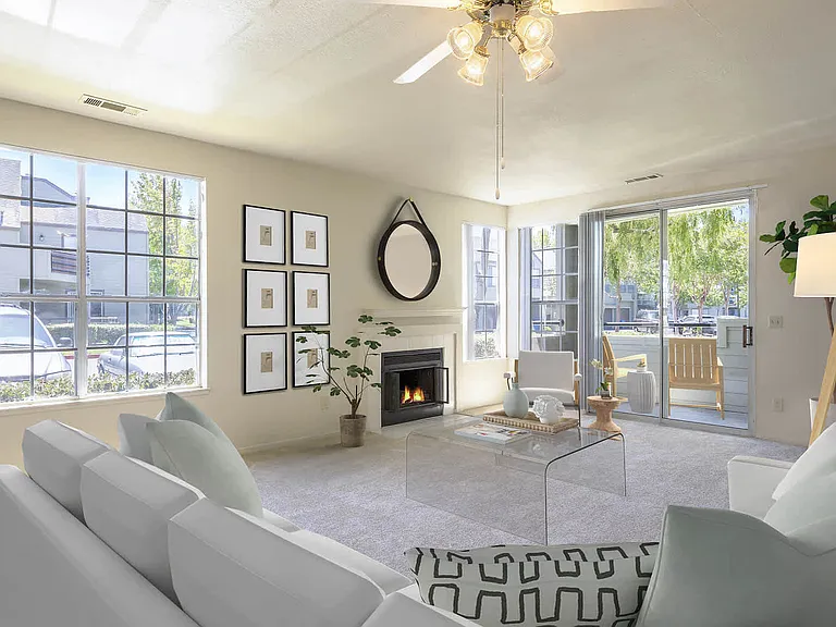 Carpeted Living Room with Fireplace and Balcony