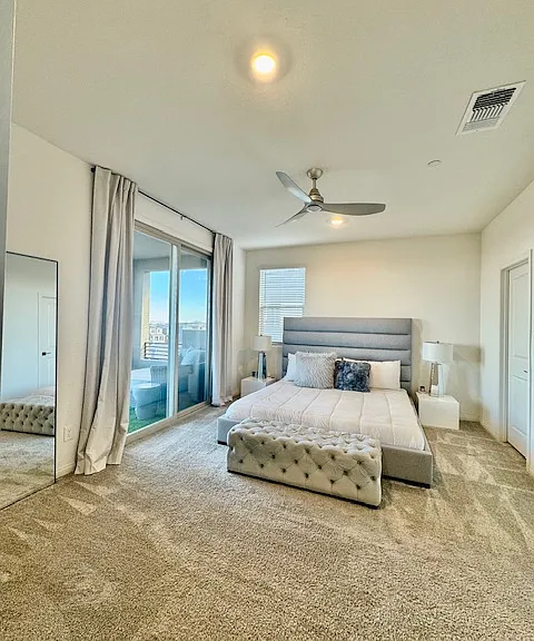 primary bedroom with large covered balcony