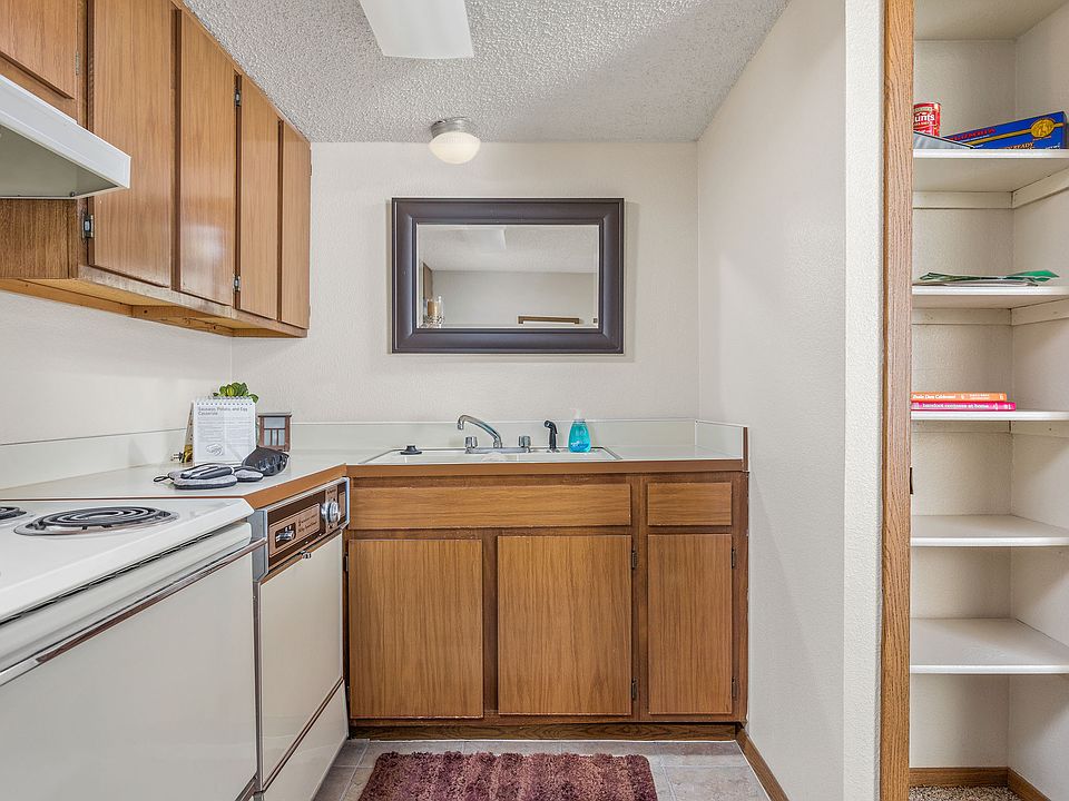Spacious Kitchen with Dishwasher and Pantry - Heritage Park Apartments