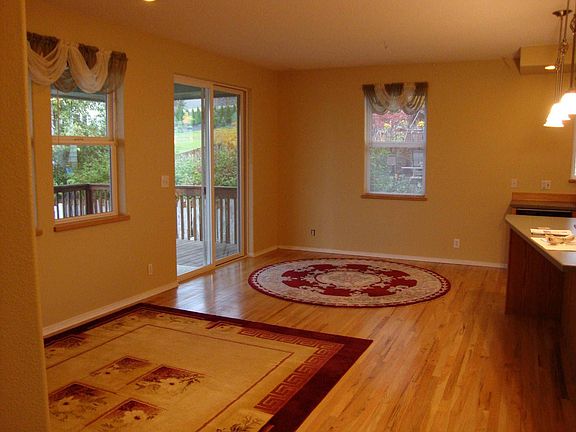 Family room adjacent kitchen, space for TV viewing, kitchen table, computer.
