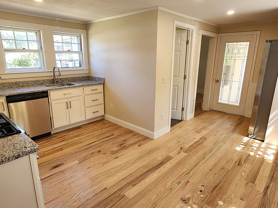 Eat-in kitchen looking at entry door.