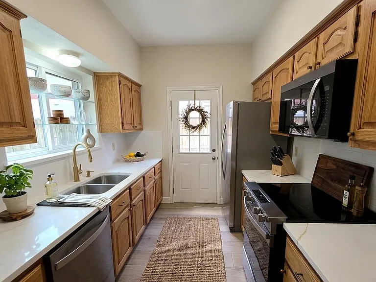 Updated kitchen featuring brand new energy efficient appliances, and fresh countertops.