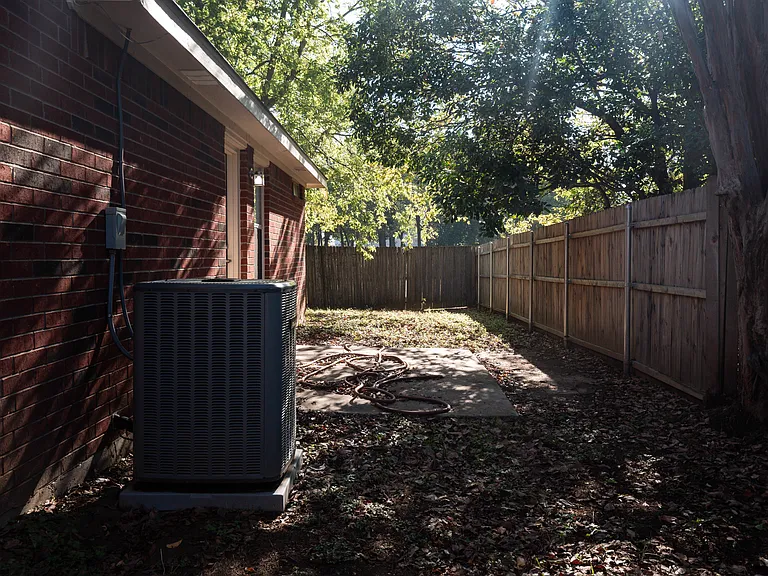 SIde yard with patio; access from dining area