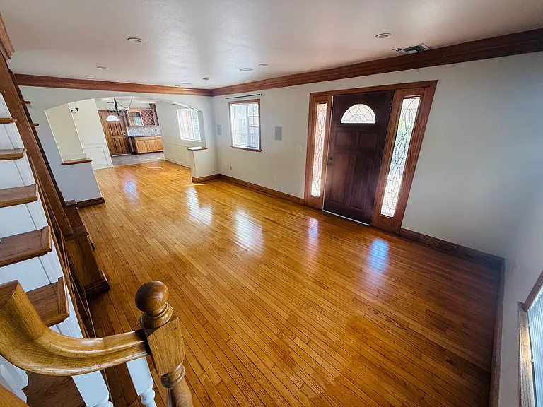 View of front door, into dining room and kitchen.
