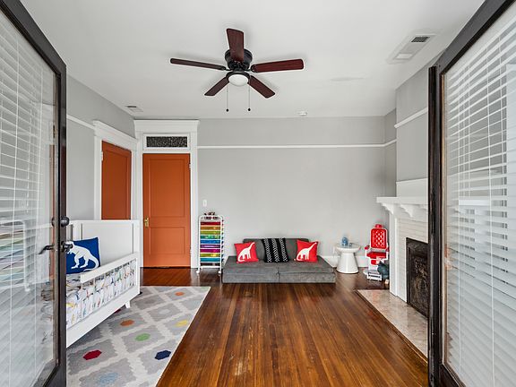 Bedroom 1 with french doors that open to the front porch