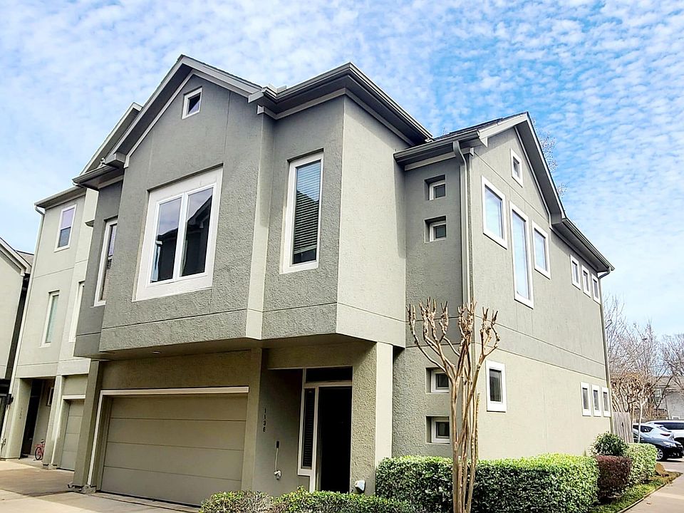 1136 Patterson house front view. Two car garage for indoor parking and additional parking adjacent to back yard. Plenty of light into this corner house in a beautiful gated community in the heart of the Washington corridor.