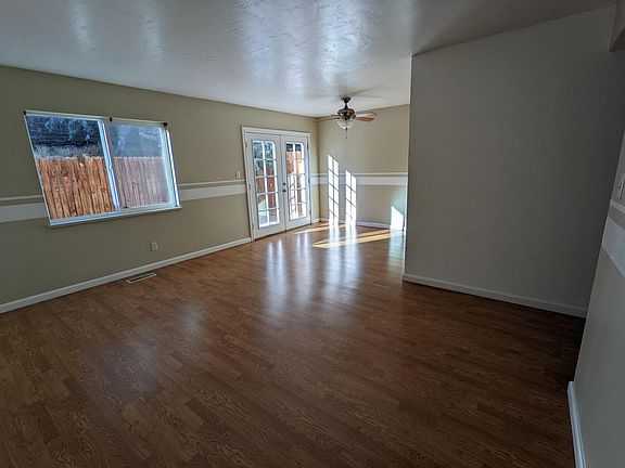 Living room/dining room areas and French doors to patio