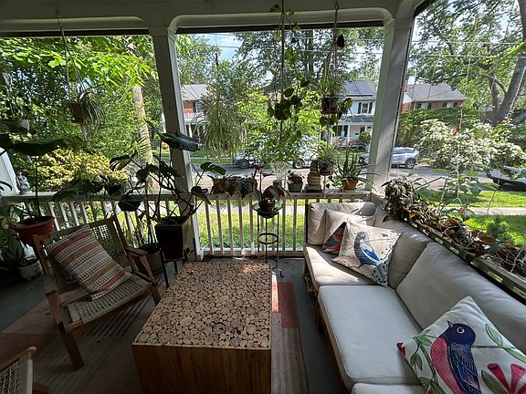 Enclosed front porch with two ceiling fans. Entrance off living room. Also has screen door to side/back yard.