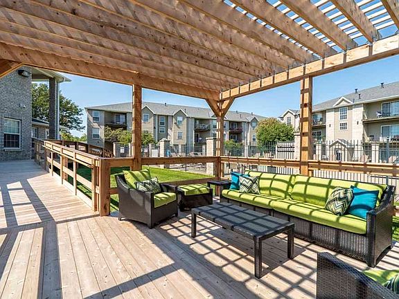 Our new pergola with lounge seating creates the perfect space for outdoor socializing.