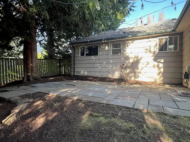 BBQ or gathering area overlooking the backyard.