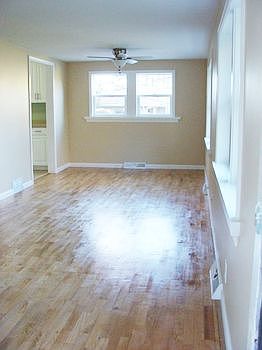  Dining room with new light,refinished hardwood floor and new paint.