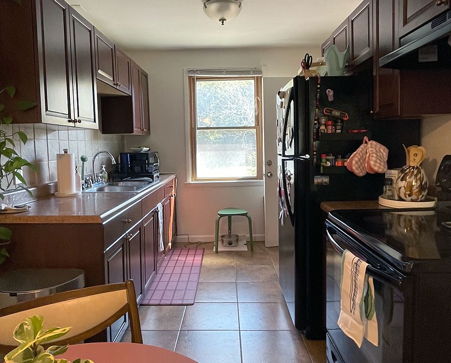Eat-in kitchen with full-size refrigerator and pantry.